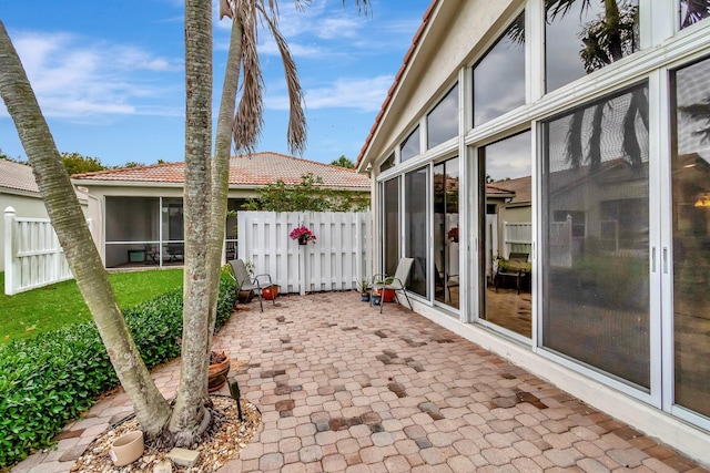 12589 Via Ravenna, Boynton Beach, FL 33436 - view of patio with a sunroom and fence