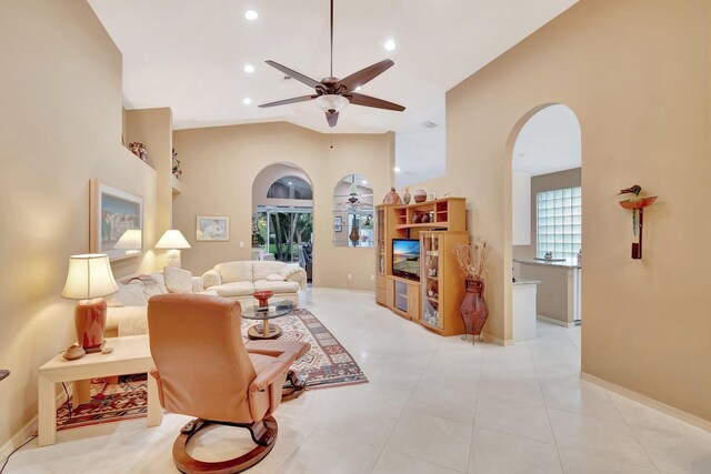 12589 Via Ravenna, Boynton Beach, FL 33436 - living room with high vaulted ceiling, recessed lighting, arched walkways, light tile patterned floors, and ceiling fan