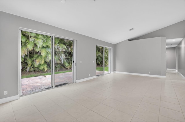 9025 Long Lake Palm Dr, Boca Raton, FL 33496 - unfurnished room featuring lofted ceiling, baseboards, and light tile patterned flooring