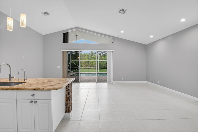 9025 Long Lake Palm Dr, Boca Raton, FL 33496 - kitchen featuring a sink, lofted ceiling, white cabinetry, open floor plan, and light tile patterned floors