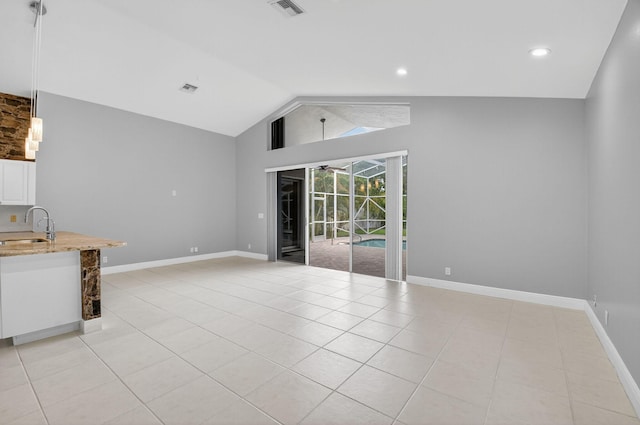 9025 Long Lake Palm Dr, Boca Raton, FL 33496 - unfurnished living room featuring light tile patterned flooring, a sink, a ceiling fan, baseboards, and high vaulted ceiling