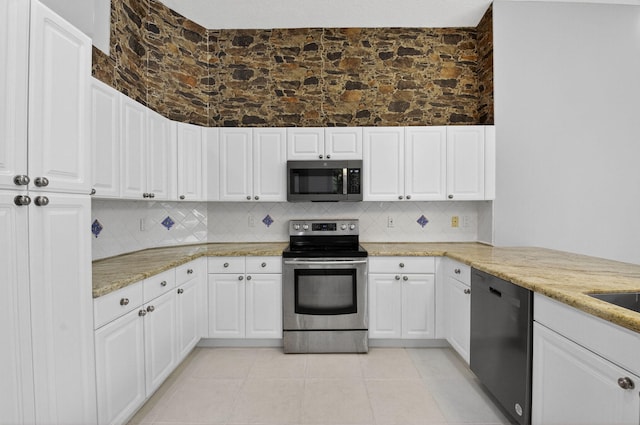 9025 Long Lake Palm Dr, Boca Raton, FL 33496 - kitchen featuring appliances with stainless steel finishes, decorative backsplash, and white cabinets