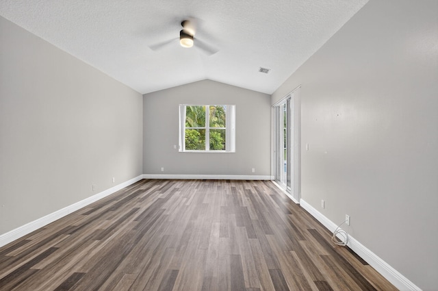 9025 Long Lake Palm Dr, Boca Raton, FL 33496 - spare room with a ceiling fan, vaulted ceiling, dark wood finished floors, a textured ceiling, and baseboards