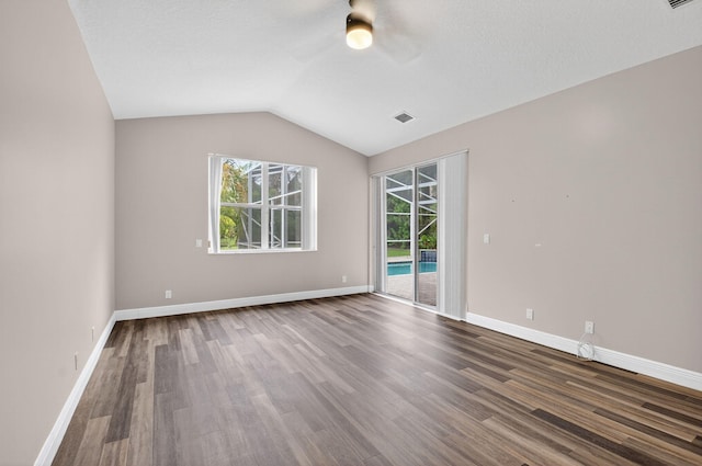 9025 Long Lake Palm Dr, Boca Raton, FL 33496 - unfurnished room with a ceiling fan, dark wood-style floors, vaulted ceiling, and baseboards
