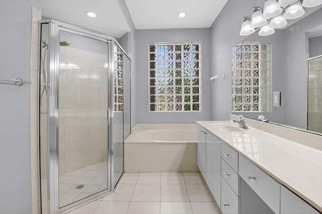 9025 Long Lake Palm Dr, Boca Raton, FL 33496 - bathroom featuring vanity, a stall shower, a garden tub, tile patterned floors, and recessed lighting