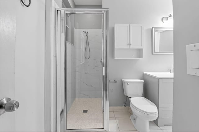 9025 Long Lake Palm Dr, Boca Raton, FL 33496 - bathroom with a marble finish shower, toilet, vanity, and tile patterned flooring