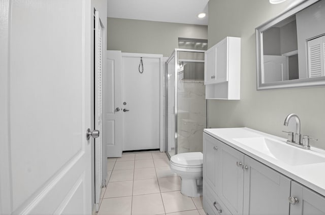 9025 Long Lake Palm Dr, Boca Raton, FL 33496 - full bathroom with a shower stall, vanity, toilet, and tile patterned floors