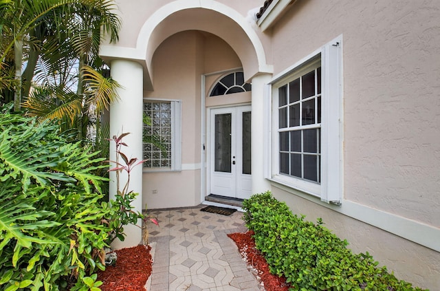 9025 Long Lake Palm Dr, Boca Raton, FL 33496 - view of exterior entry with french doors and stucco siding
