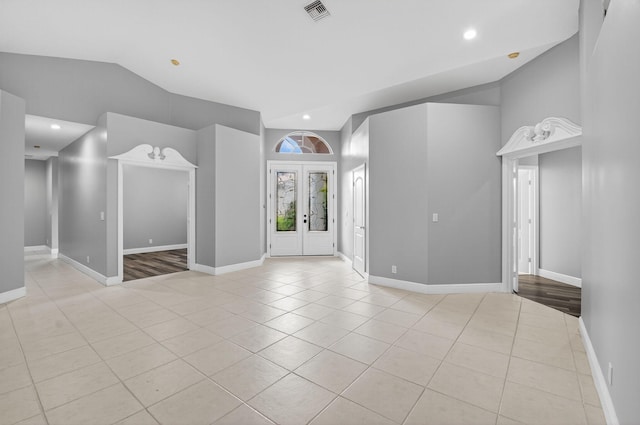 9025 Long Lake Palm Dr, Boca Raton, FL 33496 - foyer entrance with lofted ceiling, light tile patterned floors, french doors, baseboards, and recessed lighting