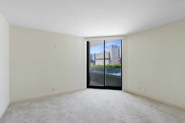 529 S Flagler Dr Unit 6E, West Palm Beach, FL 33401 - carpeted spare room with expansive windows and baseboards