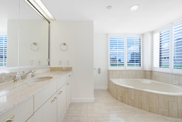 529 S Flagler Dr Unit 6E, West Palm Beach, FL 33401 - full bathroom featuring vanity, a bath, and baseboards