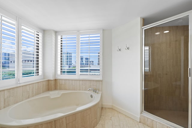 529 S Flagler Dr Unit 6E, West Palm Beach, FL 33401 - bathroom featuring a garden tub and a stall shower