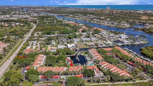 bird's eye view featuring a water view and a residential view