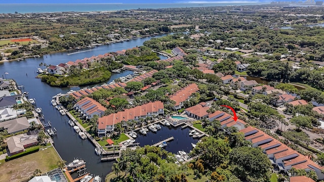 bird's eye view with a residential view and a water view