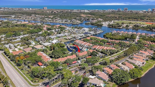 aerial view with a residential view and a water view