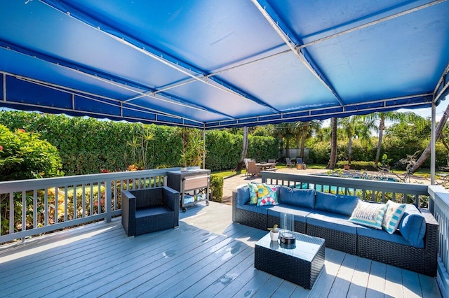 wooden terrace featuring an outdoor hangout area and outdoor dining area