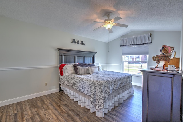 bedroom with baseboards, a textured ceiling, wood finished floors, and vaulted ceiling