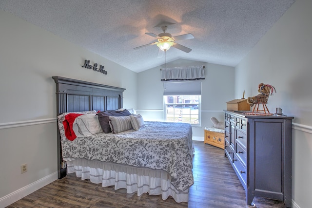 bedroom featuring baseboards, lofted ceiling, a textured ceiling, and dark wood-style floors