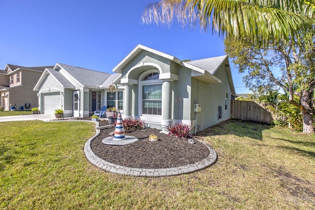 single story home featuring stucco siding, a front lawn, fence, concrete driveway, and a garage