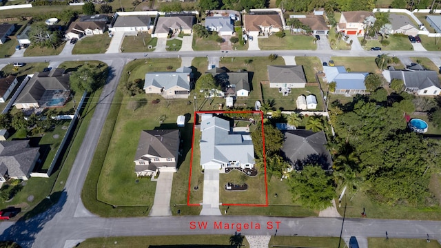 birds eye view of property with a residential view