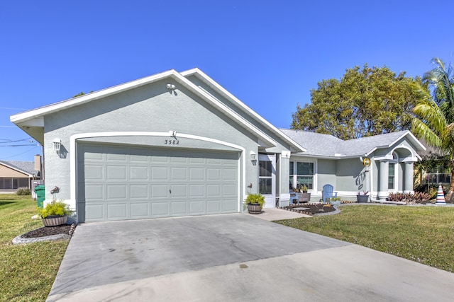 ranch-style home with a garage, stucco siding, concrete driveway, and a front yard