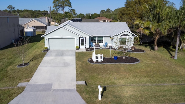 view of front facade featuring concrete driveway, an attached garage, a front yard, and stucco siding