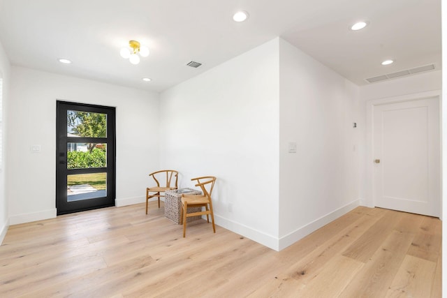 sitting room with visible vents, recessed lighting, light wood-style flooring, and baseboards