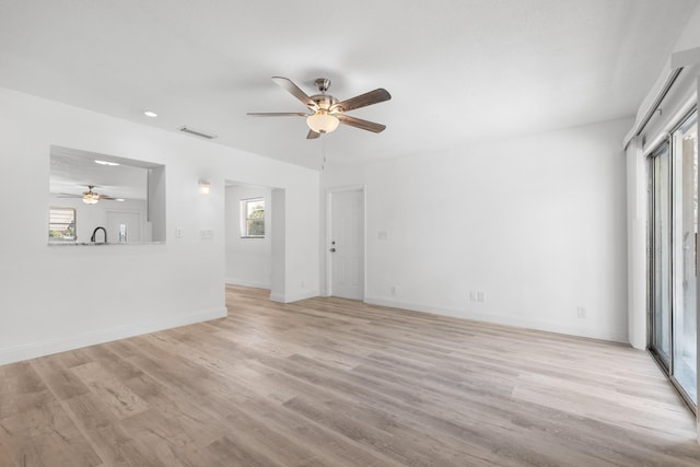 991 SW 31st St, Fort Lauderdale, FL 33315 - unfurnished living room featuring a ceiling fan, visible vents, light wood finished floors, and baseboards