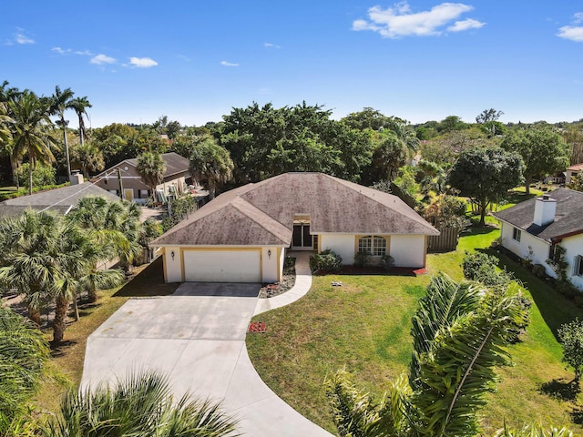 5116 Palm Way, Lake Worth, FL 33463 - ranch-style home with an attached garage, driveway, a front yard, and stucco siding