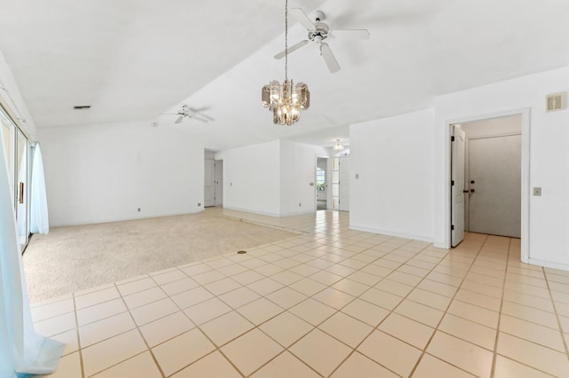 5116 Palm Way, Lake Worth, FL 33463 - unfurnished living room with ceiling fan, a chandelier, lofted ceiling, light tile patterned floors, and light colored carpet