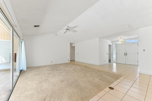5116 Palm Way, Lake Worth, FL 33463 - unfurnished living room with a ceiling fan, light tile patterned floors, lofted ceiling, and light colored carpet