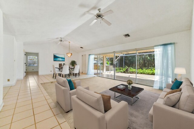 5116 Palm Way, Lake Worth, FL 33463 - living room featuring ceiling fan, lofted ceiling, light tile patterned floors, a sunroom, and baseboards