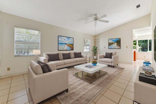 5116 Palm Way, Lake Worth, FL 33463 - living area featuring light tile patterned floors, vaulted ceiling, and ceiling fan