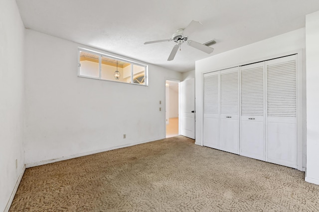 5116 Palm Way, Lake Worth, FL 33463 - unfurnished bedroom with a closet, baseboards, and a ceiling fan