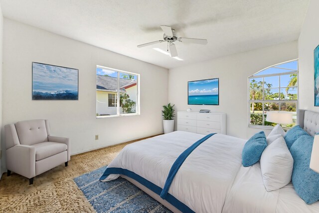 5116 Palm Way, Lake Worth, FL 33463 - carpeted bedroom featuring multiple windows and a ceiling fan