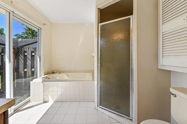 5116 Palm Way, Lake Worth, FL 33463 - full bath with a stall shower, tile patterned floors, a garden tub, and toilet