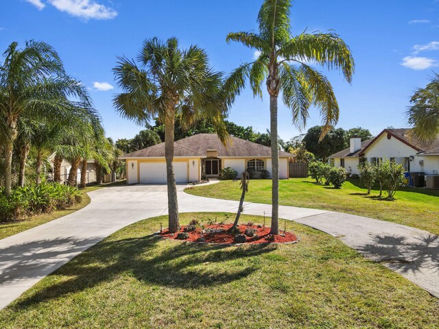 5116 Palm Way, Lake Worth, FL 33463 - single story home with curved driveway, a front yard, a garage, central AC unit, and stucco siding
