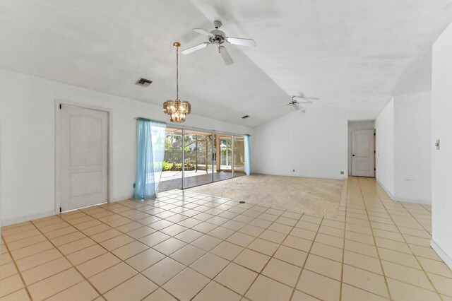 5116 Palm Way, Lake Worth, FL 33463 - unfurnished room with lofted ceiling, ceiling fan, a chandelier, light tile patterned flooring, and light colored carpet