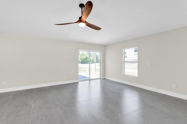 8585 100th Ave, Vero Beach, FL 32967 - empty room with ceiling fan and baseboards
