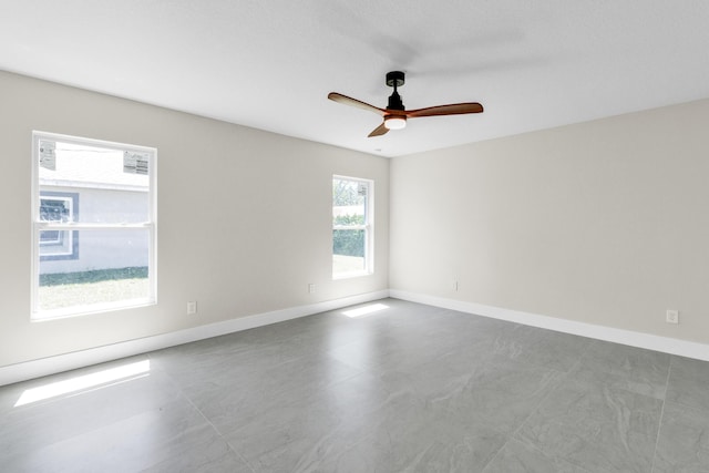 8585 100th Ave, Vero Beach, FL 32967 - empty room with ceiling fan and baseboards