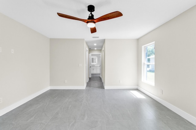 8585 100th Ave, Vero Beach, FL 32967 - unfurnished room with a ceiling fan and baseboards