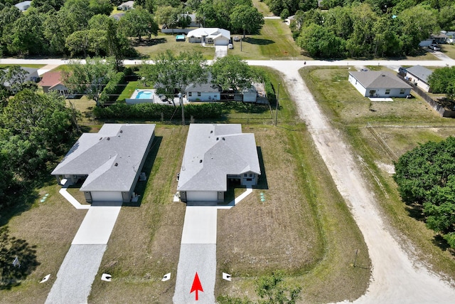 8585 100th Ave, Vero Beach, FL 32967 - aerial view of property and surrounding area featuring nearby suburban area