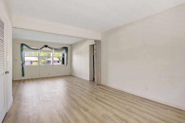3212 NE 8th Ct Unit 7, Pompano Beach, FL 33062 - spare room with light wood finished floors and baseboards