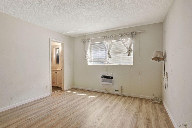 3212 NE 8th Ct Unit 7, Pompano Beach, FL 33062 - empty room with wood finished floors, a textured ceiling, and baseboards