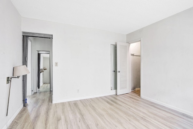 3212 NE 8th Ct Unit 7, Pompano Beach, FL 33062 - unfurnished bedroom featuring light wood finished floors and baseboards