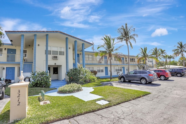 3212 NE 8th Ct Unit 7, Pompano Beach, FL 33062 - view of building exterior featuring uncovered parking