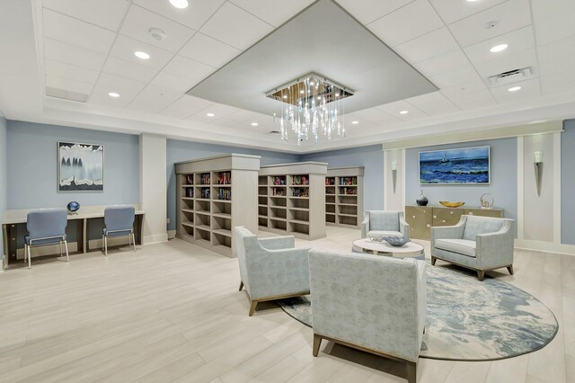 6100 Waldwick Cir, Delray Beach, FL 33484 - interior space with visible vents, baseboards, a tray ceiling, and an inviting chandelier