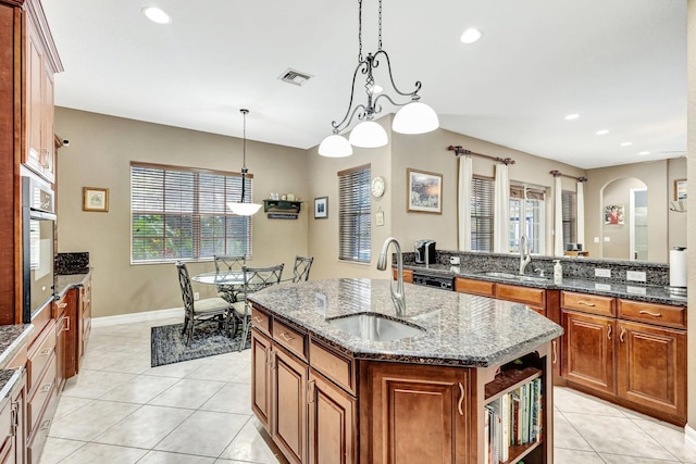 3434 Vanderbilt Dr, Wellington, FL 33414 - kitchen with a kitchen island with sink, stainless steel oven, visible vents, and a sink