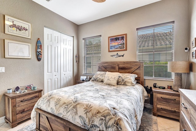 3434 Vanderbilt Dr, Wellington, FL 33414 - bedroom with light tile patterned floors, a closet, and multiple windows