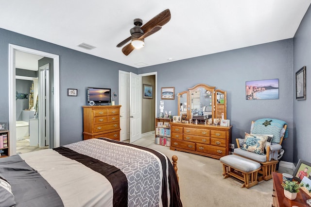 3434 Vanderbilt Dr, Wellington, FL 33414 - bedroom with visible vents, light carpet, a ceiling fan, ensuite bath, and baseboards